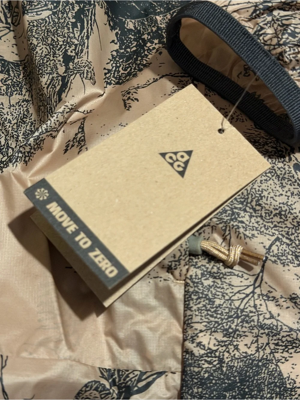 Nike ACG Hooded Jacket in Desert Tan and Black Nature Print
